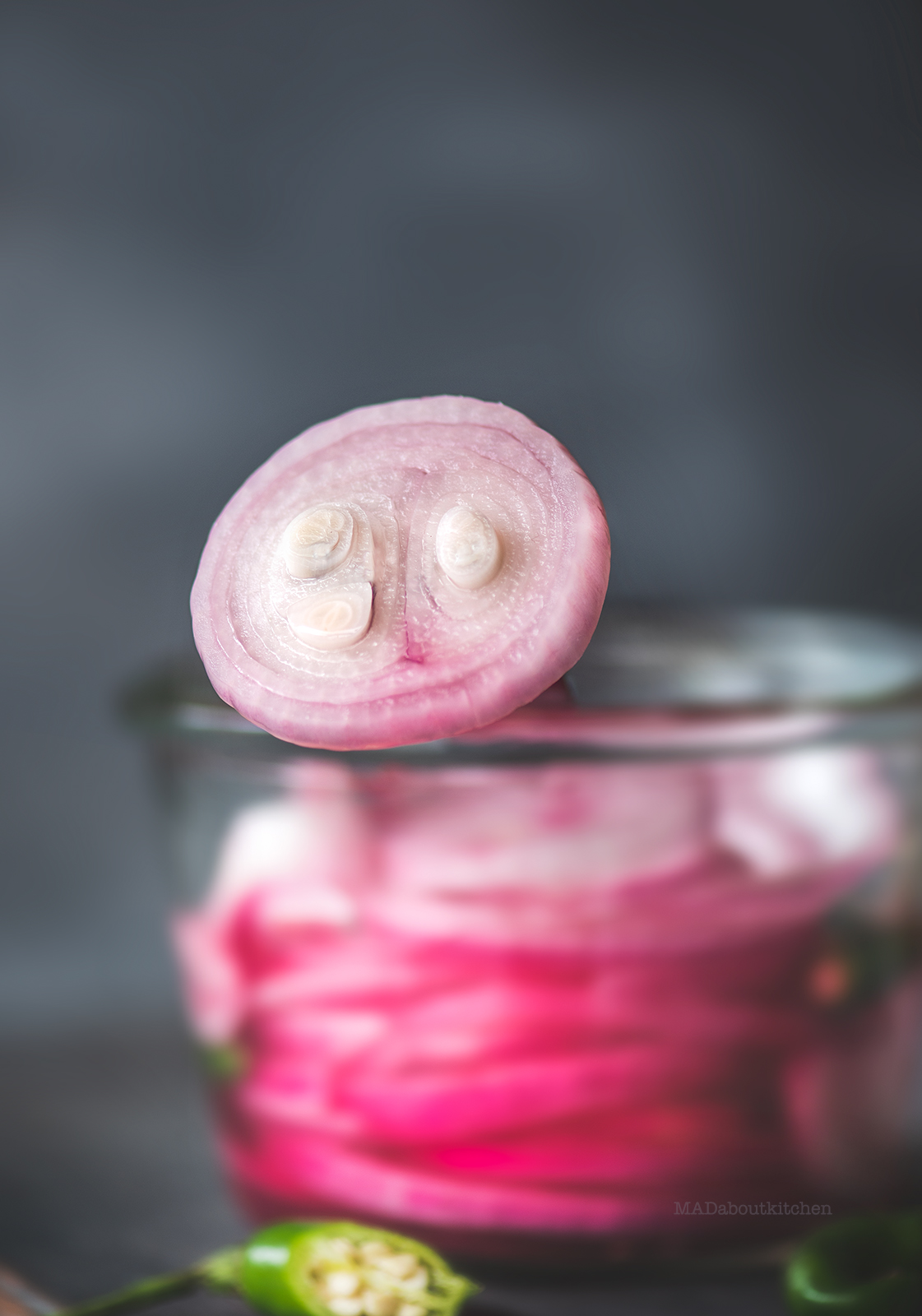 Khatta pyaaz is pickled onions.Onion pickled in vinegar or lemon juice ending in beautiful, tangy, sweet onions. A perfect accompaniment with Indian dishes.