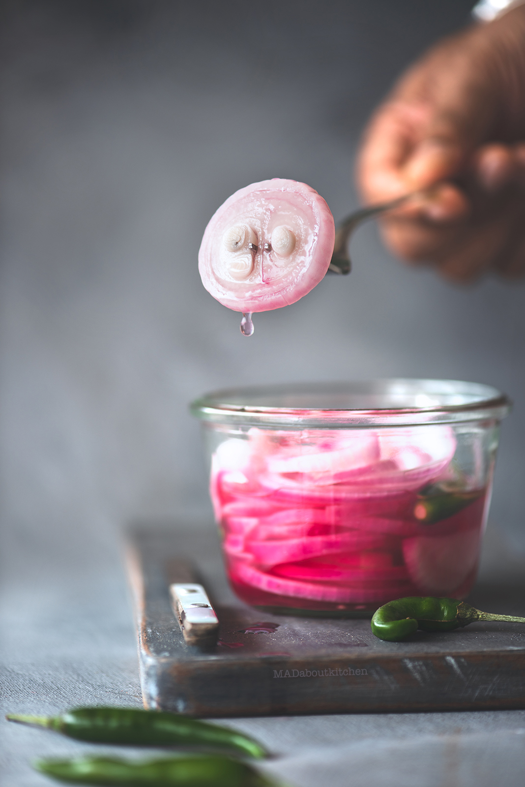 Khatta pyaaz is pickled onions.Onion pickled in vinegar or lemon juice ending in beautiful, tangy, sweet onions. A perfect accompaniment with Indian dishes.