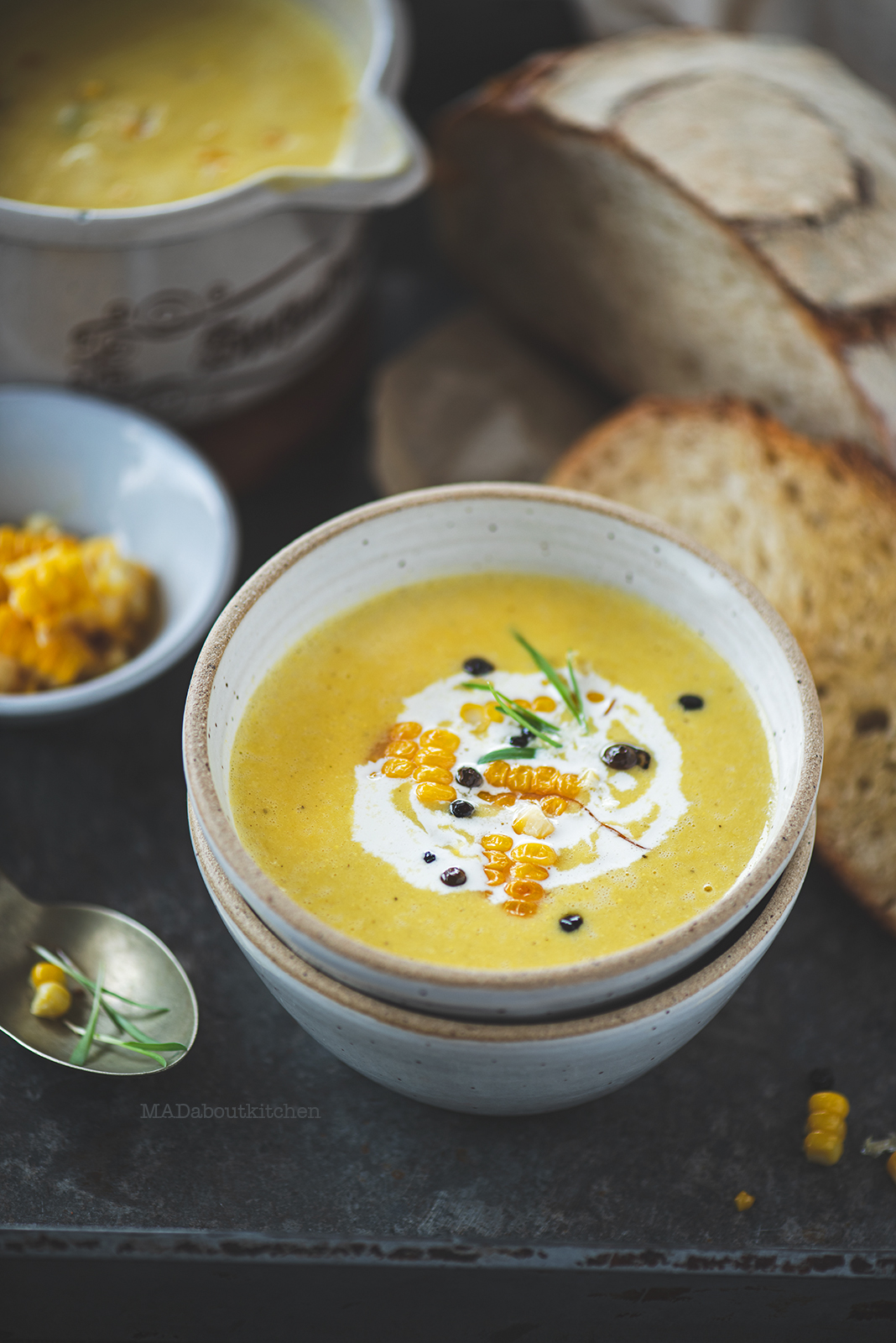 Corn soup is a creamy, light soup that is flavoured using garlic, rosemary and is served with a slice of crusty sourdough bread.