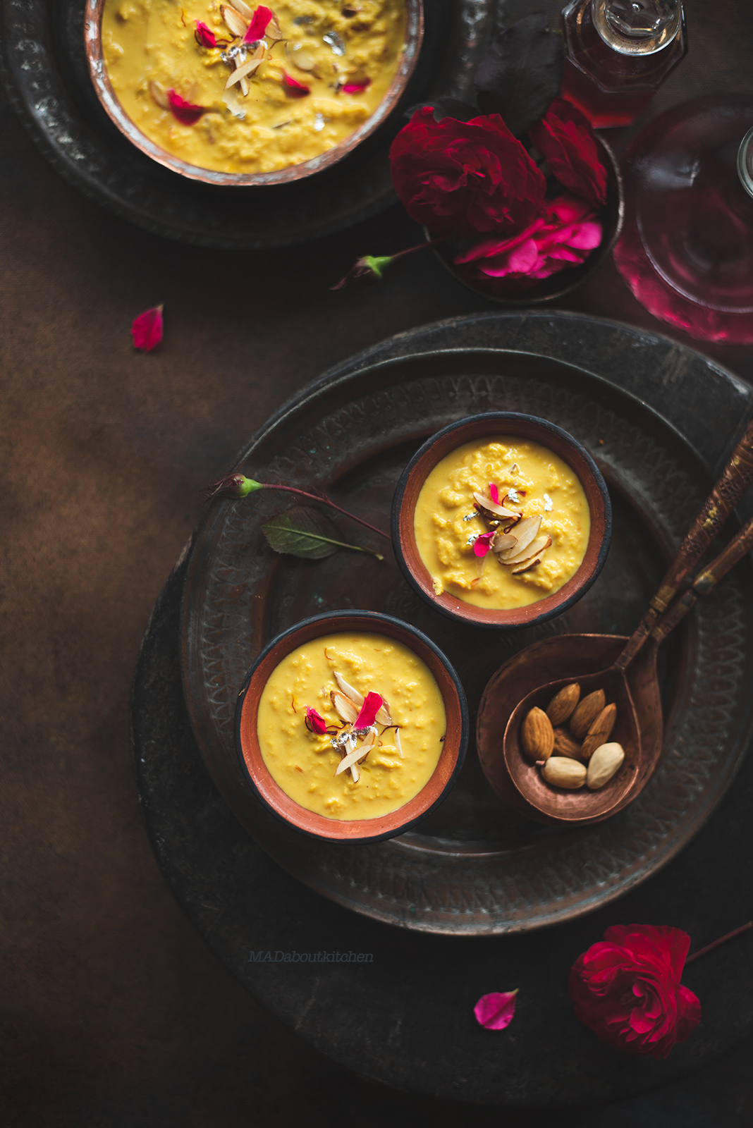 Rabdi, is an Indian dessert made by reducing whole milk to layers of cream. It is flavoured using saffron & is garnished with almonds & rose petals.