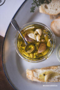 Confit Garlic is nothing but garlic cloves slow cooked in oil along with herbs. This is a fool proof recipe for a flavourful condiment that can be added to lot of dishes, spread, salad and butter or just have it along with some rustic bread.