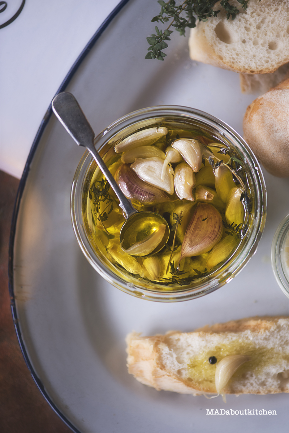 Confit Garlic is nothing but garlic cloves slow cooked in oil along with herbs. This is a fool proof recipe for a flavourful condiment that can be added to lot of dishes, spread, salad and butter or just have it along with some rustic bread.