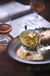 Confit Garlic is nothing but garlic cloves slow cooked in oil along with herbs. This is a fool proof recipe for a flavourful condiment that can be added to lot of dishes, spread, salad and butter or just have it along with some rustic bread. Confit Garlic is a simple yet a flavourful condiment that should always be there in the refrigerator :) and it makes the perfect gift too.