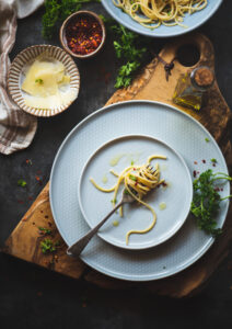 Aglio e Olio is one of the most famous, quick & basic Italian pasta recipes. Aglio e Olio means Garlic & Oil which are the main ingredients of this dish.