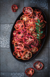 In these  difficult times of Covid-19, when every city is under lockdown and when everyone is restricted to their homes, my respect for age old methods and practices has gone up another level. I have always been a believer in our age old methods and traditions and these situations have made my beliefs more stronger. During these trying times cooking for the family, cleaning up every cupboard from top to bottom, spending all my time with family and taking everything slowly is what is keeping us sane. It feels like we have gone back 2 centuries back and I am loving it. Less waste generation, eating home cooked food, observing every new leaf that grows in the plants and staying home over the weekend.  When all this is over, I wish we can still stick to some of these changes we have made now. Back to Sun-dried tomato Pickle. I am using this time in hand to dry tomatoes to make Sun-dried tomatoes and store them for Salads, pastas and soups. You can check out the recipe here. I also made this Tomato Oorgaayi and trust me it is worth all the effort.