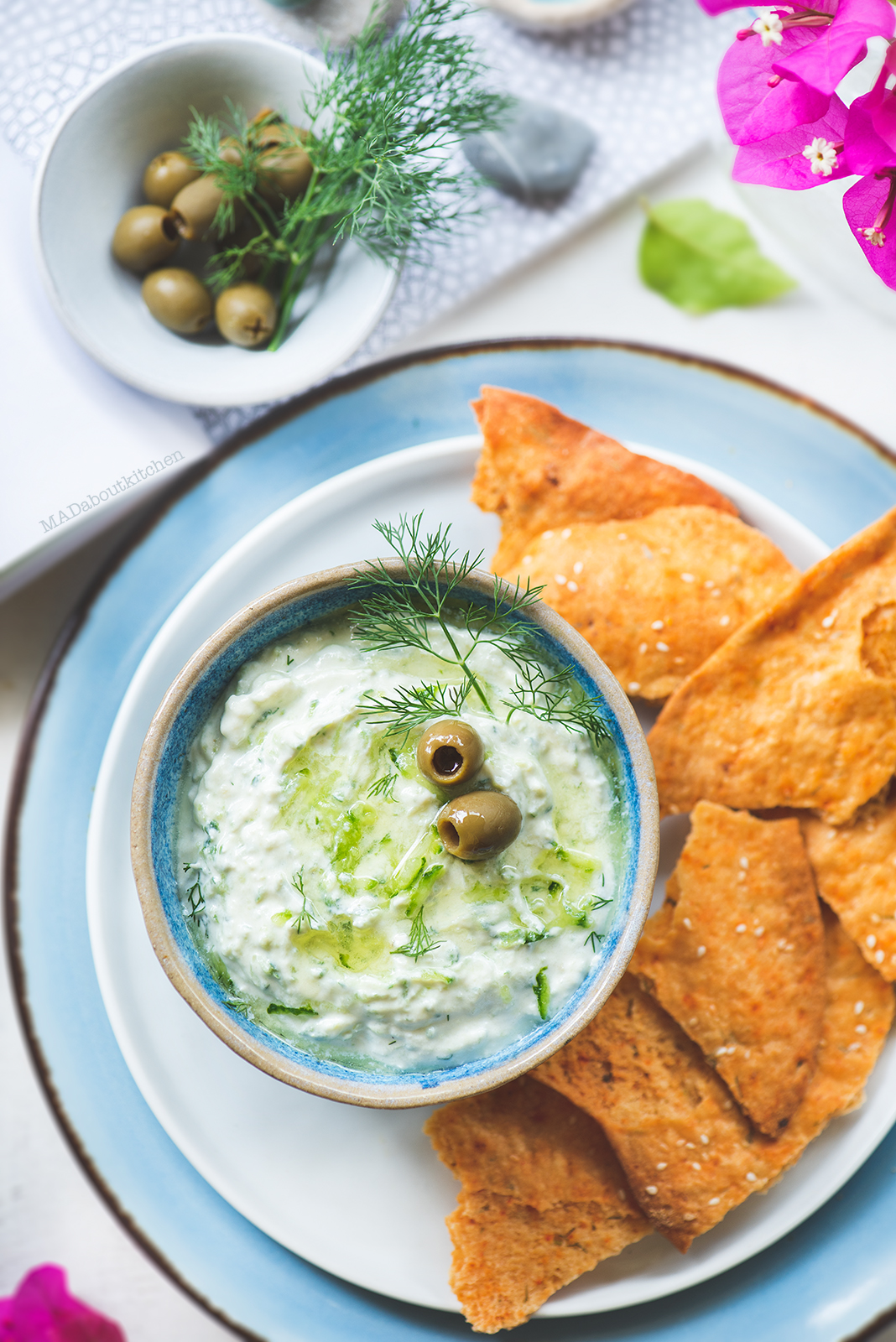 Tzatziki, the greek yogurt dip is a simple dip made using hung curd and is flavoured with garlic, dil leaves and drizzled with extra virgin olive oil.