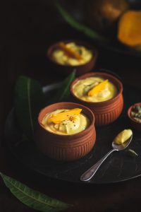 Mango Shrikhand is nothing but Mango flavoured yogurt that is absolutely rich and creamy and is served chilled as dessert or with Poori.
