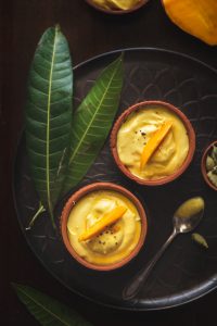 Mango Shrikhand is nothing but Mango flavoured yogurt that is absolutely rich and creamy and is served chilled as dessert or with Poori.