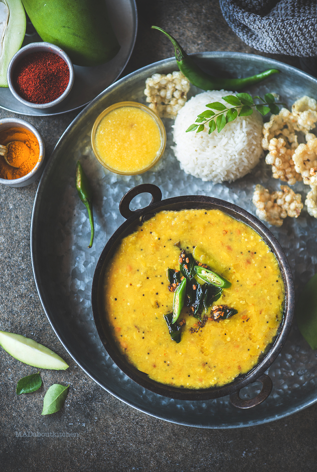 Mamidikaaya Pappu or the raw mango curry is a speciality from Andhra Pradesh. The sour ,spicy curry is served with steamed rice and ghee and some fryums.