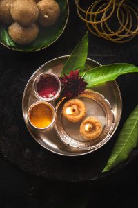 Tambittu or Akki tambittu is a rice preparation with jaggery and nuts and is offered to the god by making lamps out of them & are then served as prasada.